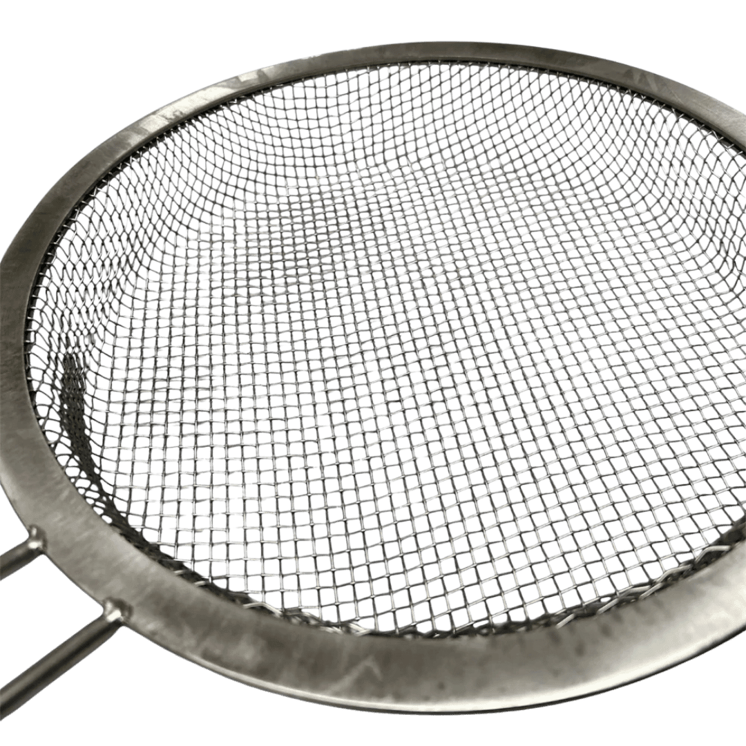 Omberg asado ember basket steel in use over open flame in Argentine asado grill