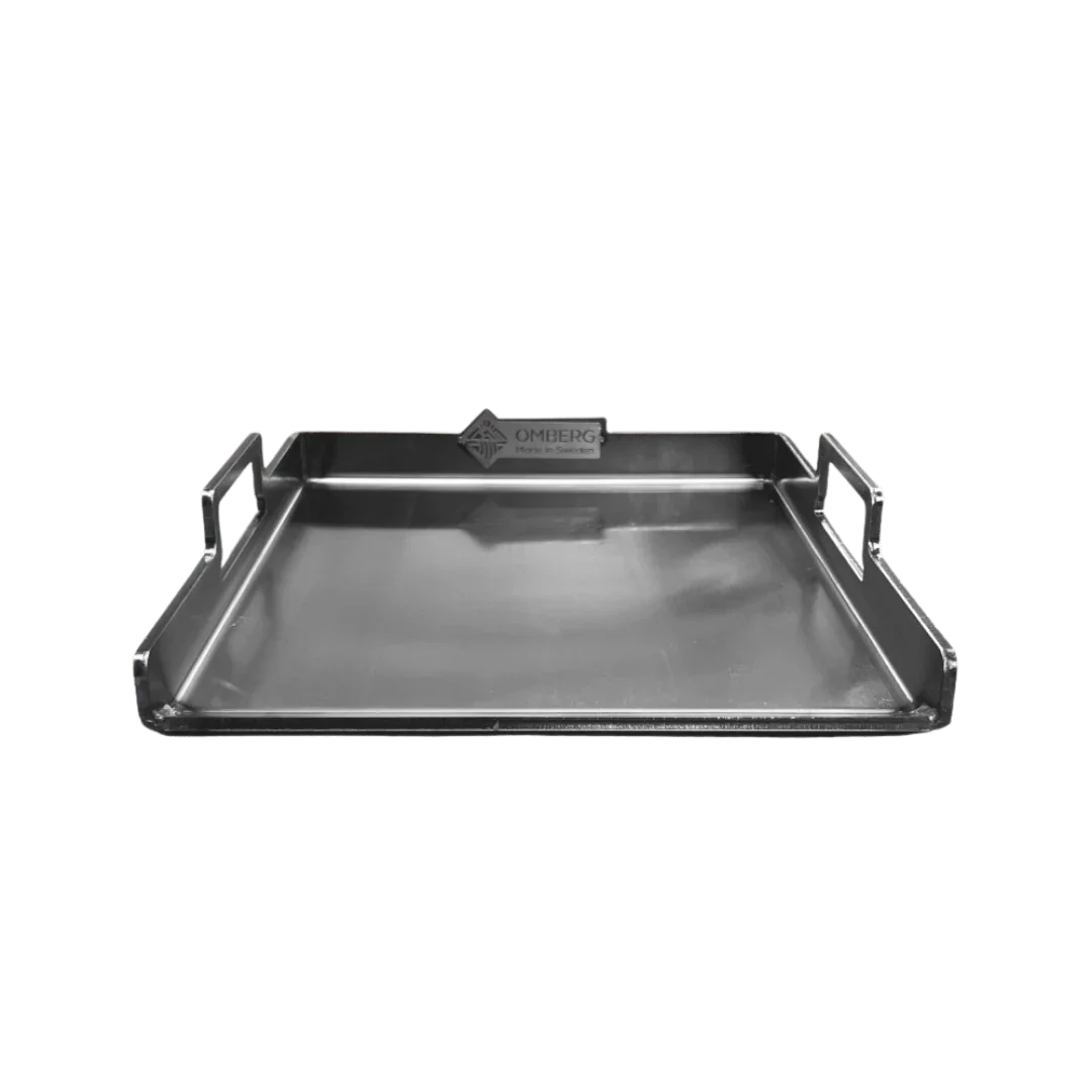 Omberg carbon steel griddle on brasero shelf, in use over live fire