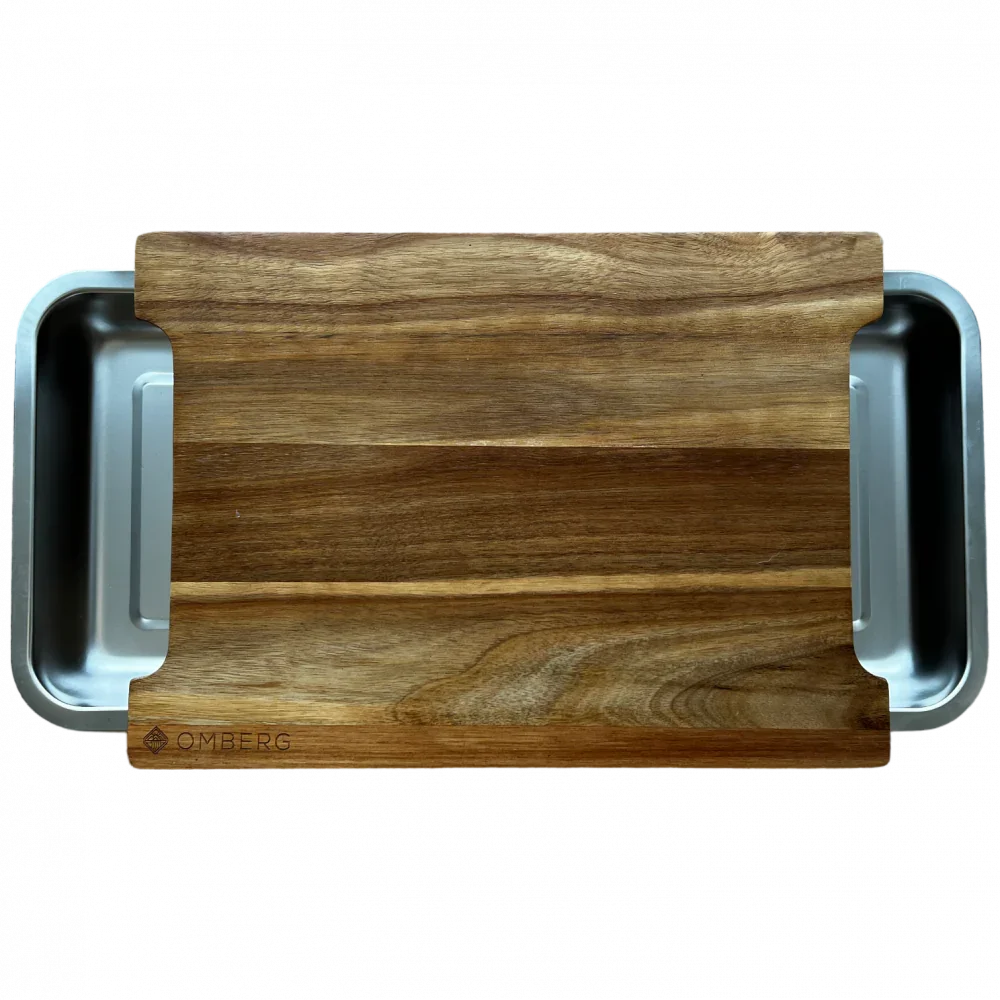 Omberg cutting board with stainless steel collection bowls, top view showing juice groove
