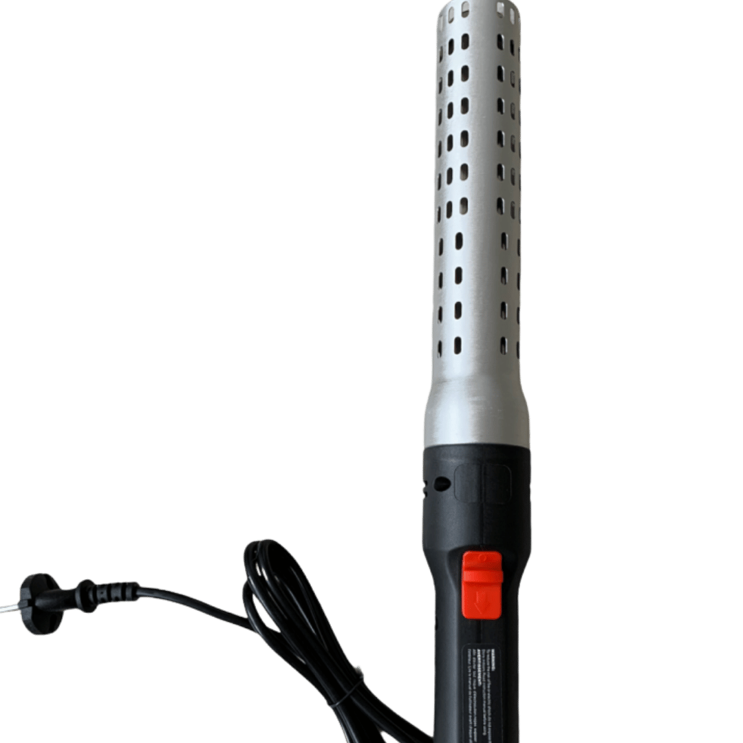 Omberg electric charcoal starter in use lighting charcoal, side view showing heating element