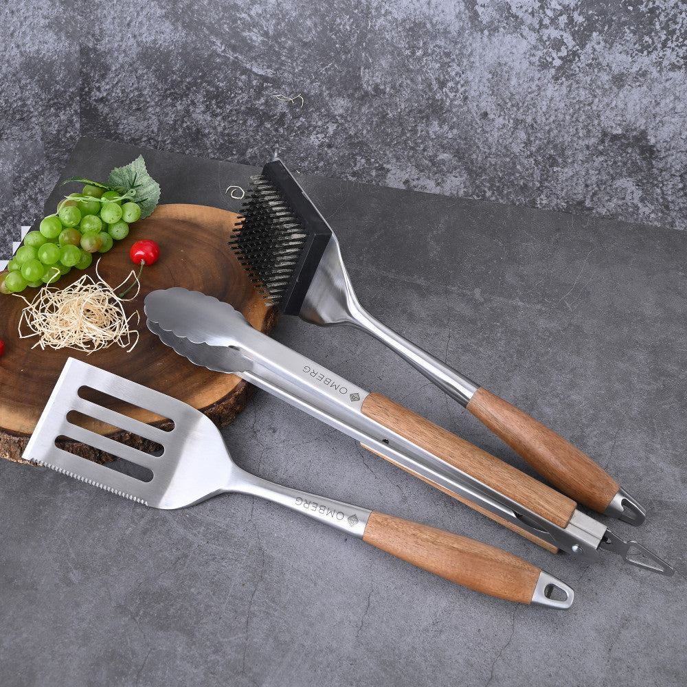 BBQ tool set with brush, spatula, and tongs.