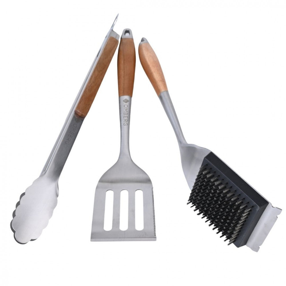 BBQ tool set with brush, spatula, and tongs.