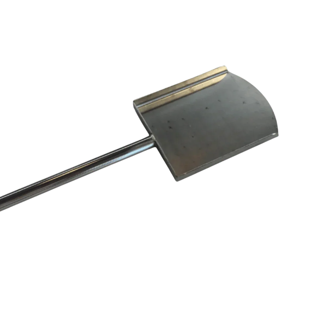 Omberg asado firewood shovel steel in use moving burning wood in grill