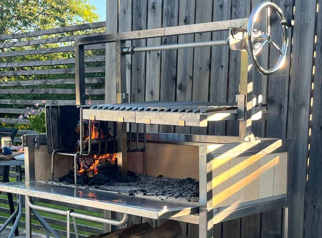 Image from a satiesfied customer showing his Omberg Asado Guacho 1200 Parilla Grill on his porch thats preparing to cook a parilla feast
