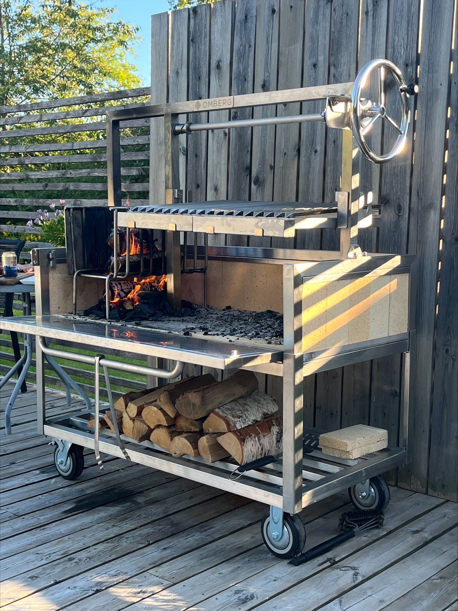 Picture of Omberg Asado Gaucho being lit up and prepared for a meal. 
