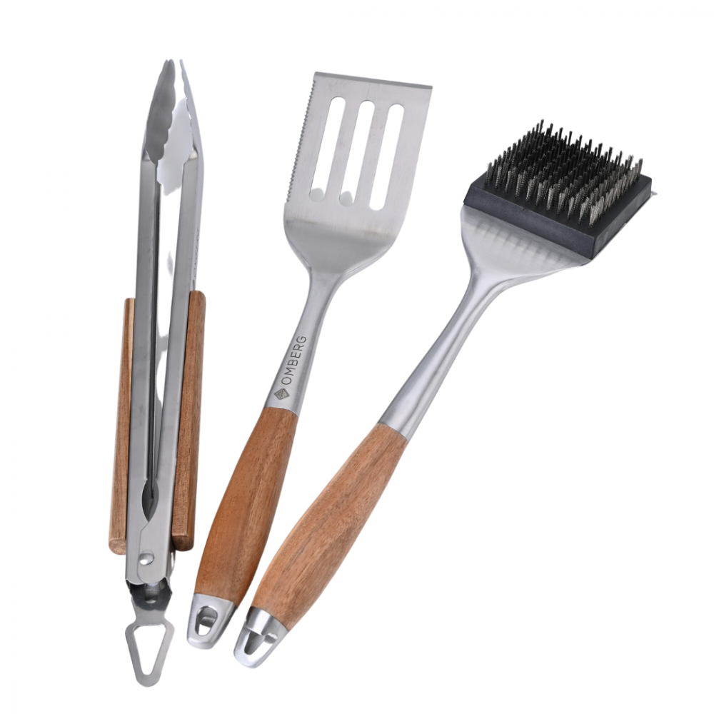 BBQ tool set with brush, spatula, and tongs.